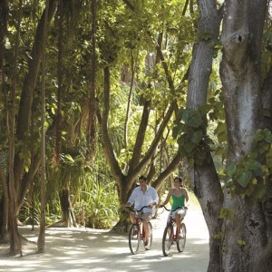 Couple cycling around the resort